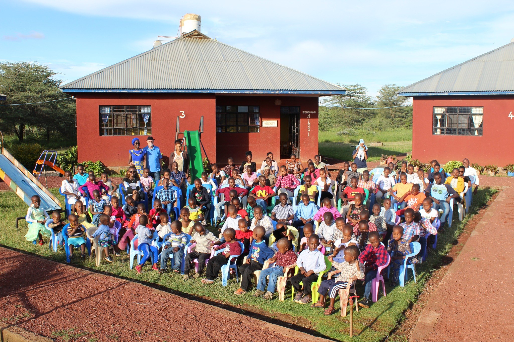 Children and staff gathered at Falcos Village