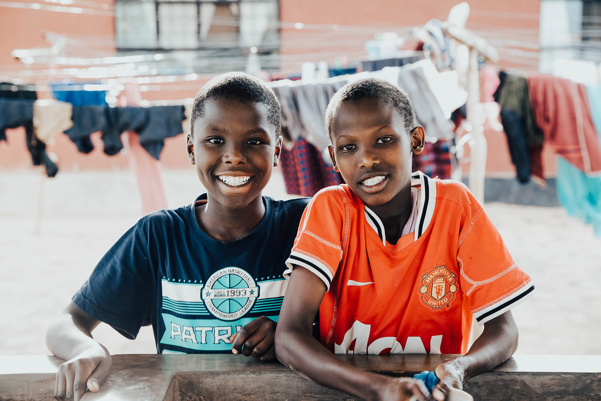 Two boys smiling together