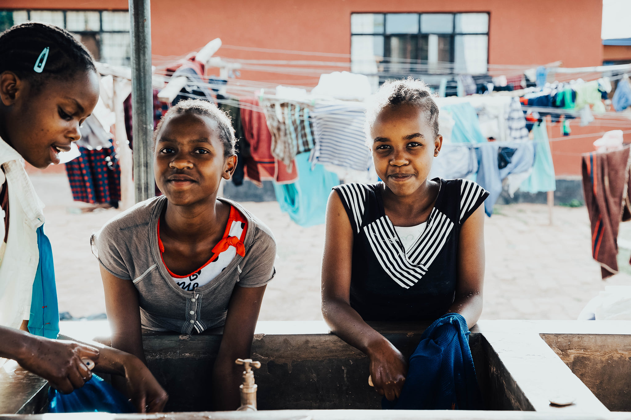 Girls at water basin